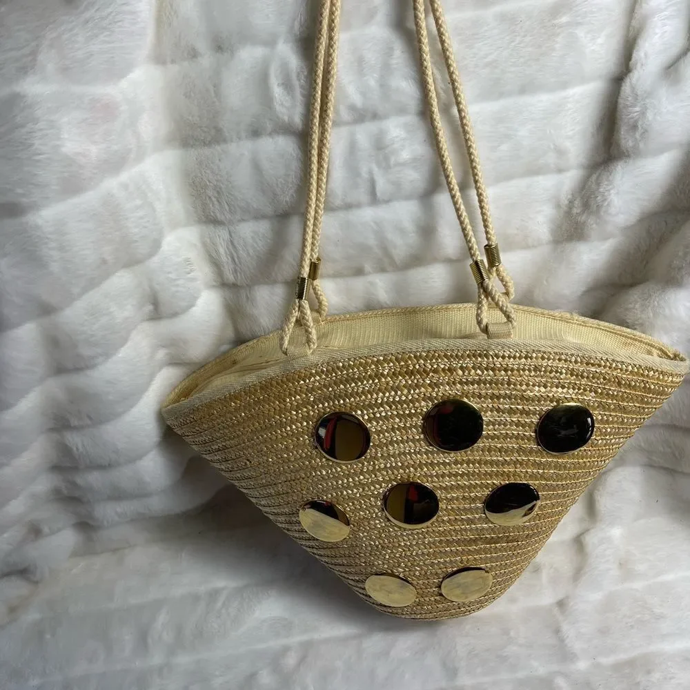 Natural straw bucket style tote bag with rope straps with gold tone acce…